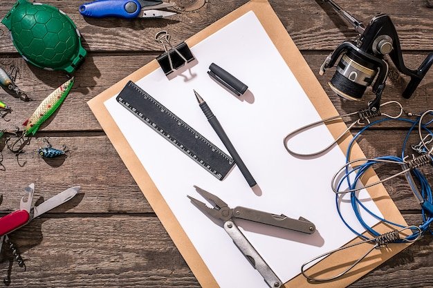 A well-organized workbench with various tools and electronic components. The tools include precision screwdrivers, a multimeter, soldering iron, and a magnifying glass.