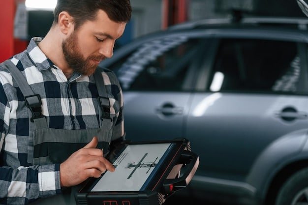 A car mechanic using a diagnostic tool to inspect the engine of a used car at a dealership. The mechanic is focused and professional, highlighting the importance of pre-purchase inspections.