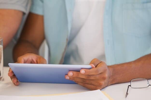 A person reviewing health insurance plans on a tablet, highlighting the importance of researching different coverage options for gig workers.