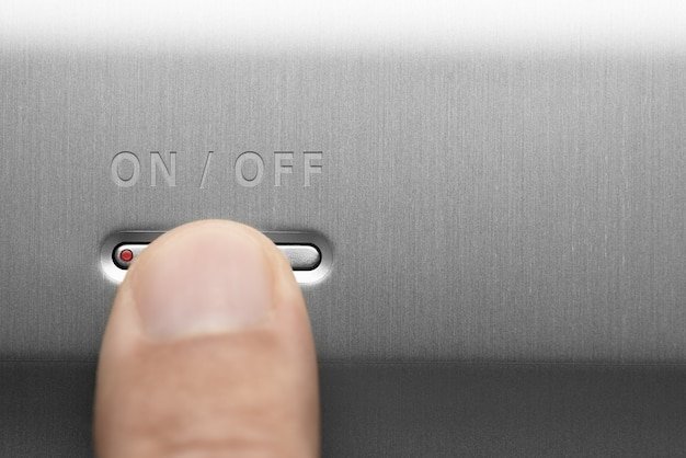 Close-up shot of an Energy Star label on a stainless steel refrigerator, clearly showing the certification mark. The background is slightly blurred to keep the focus on the label.