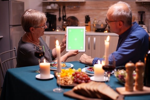 A family gathered around a dining table, enjoying a healthy and delicious meal planned using a meal planning app. The app is displayed on a tablet in the center of the table, showing the recipe and nutritional information.